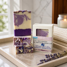 Two bars of soap with a packaging box labeled 'RDC Essentials' on a tray.